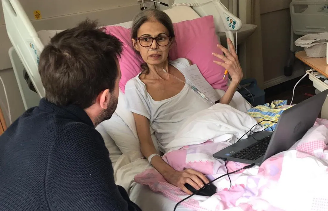Photo of me and Leti (an early MyWishes adopter) discussing how MyWishes can be improved