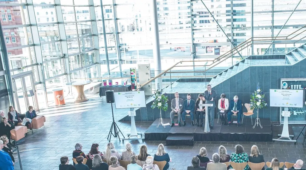 Photo from the Senedd, Wales. Dr Mark Taubert, James Norris, Gwyneth Lewis (Wales first Poet Laureate), Mark Drakeford (Welsh First Minister), Baroness Ilora Finlay & Hywel Francis (Welsh historian and former politician).